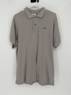 Lacoste polo shirt in a light gray color with a signature green crocodile logo